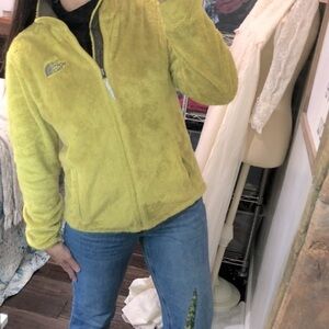 The North Face green fuzzy jacket size medium with pockets